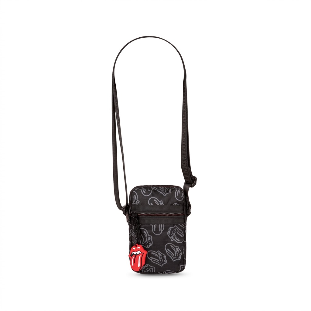 A high-resolution product shot of the black Bugatti x Rolling Stones mobile case against a pure white background. The small crossbody bag, made of grey-on-black logo-patterned ripstop polyester, features a prominent red tongue logo charm attached to the zipper pull. Full black shoulder strap included.
