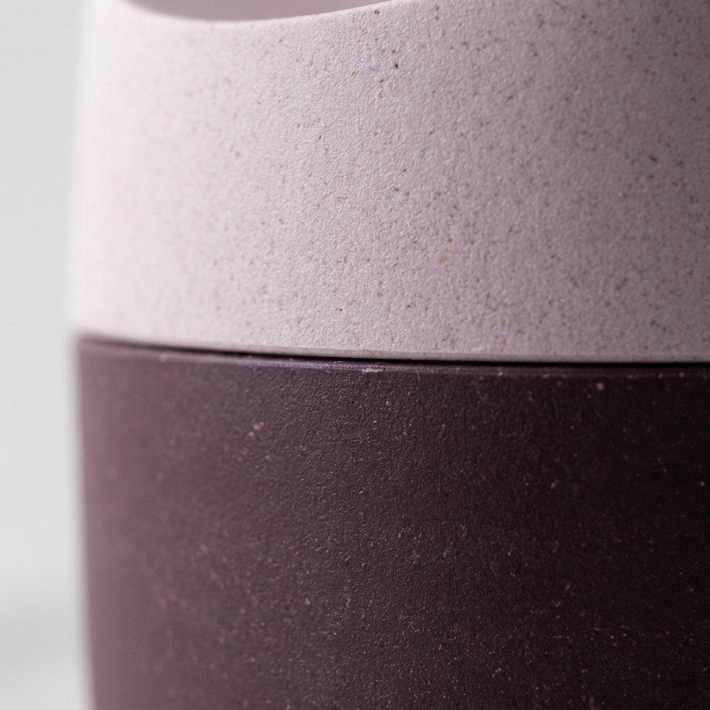 Macro detail of the Happy Sinks KONNA fruit fly trap showing the textured Garden Rose wood composite.