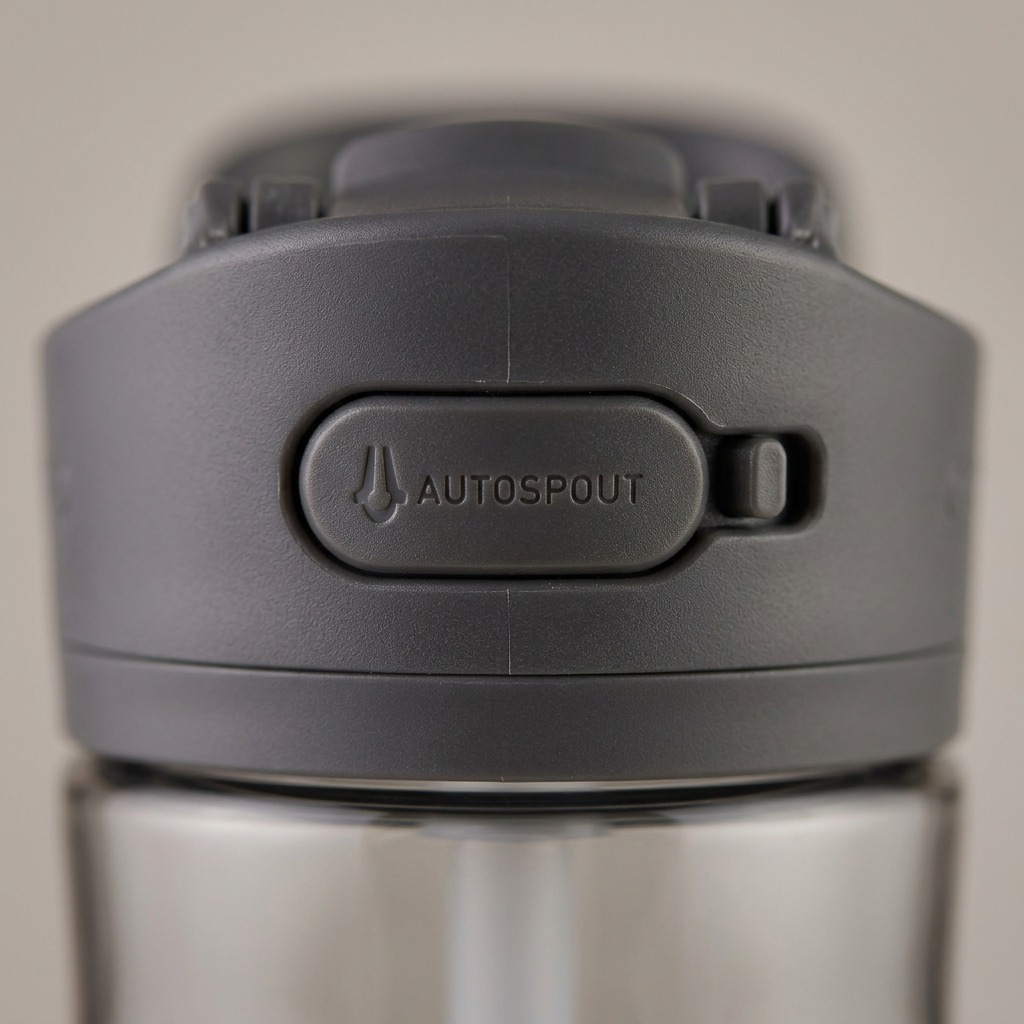 Macro image of the grey plastic AUTOSPOUT button mechanism of the Contigo Ashland 2.0 water bottle.