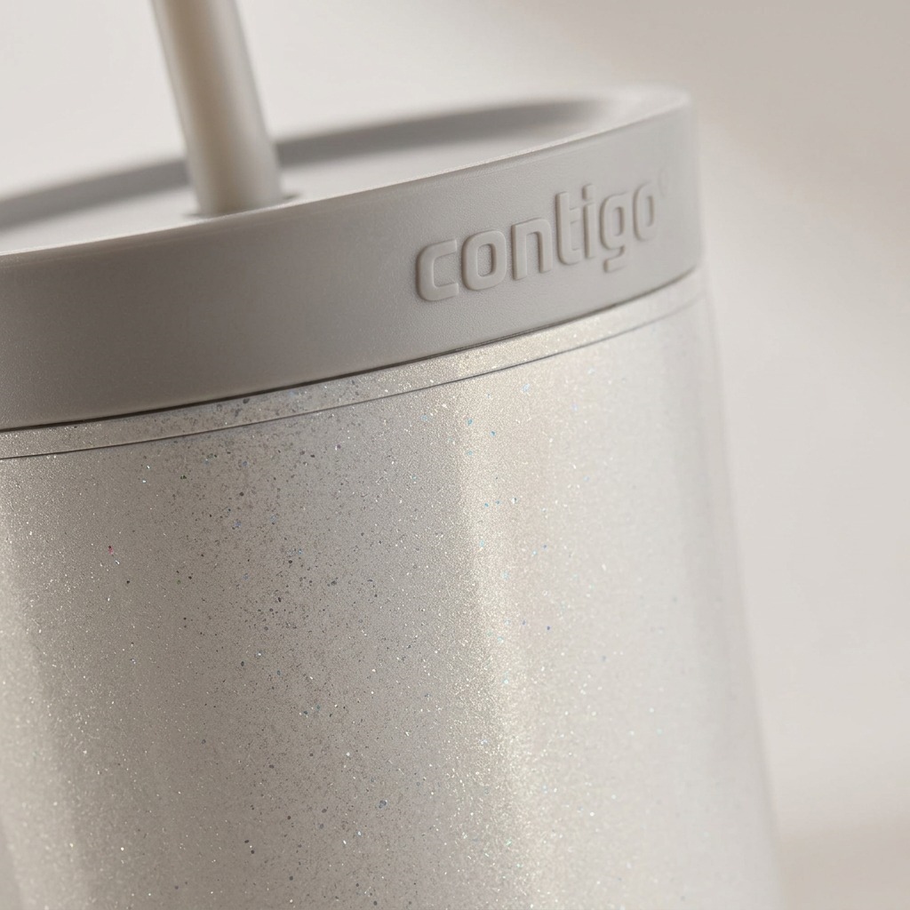 Extreme close-up of the tumbler's glittery macaroon finish and debossed lid detail.